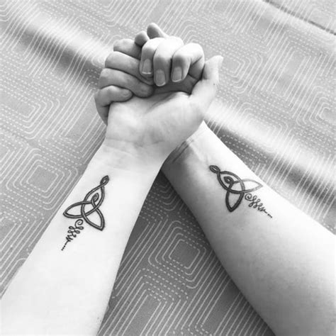 Mother daughter celtic knot tattoo - The Innovative Mother Daughter Tattoo Idea. Source:@queeniestory via Instagram. Source:@amayo5.7 via Instagram. Source:@brendaversion2.0 via Instagram. ... From simplified Celtic knots, to stylized mother daughter symbols, clean matching ink can show that sometimes less truly is more. These excellent tattoos are great examples of what is ...